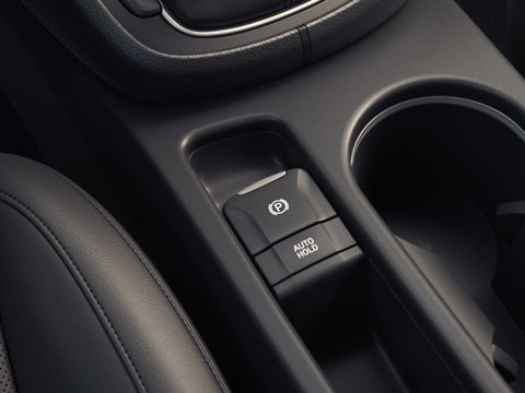 Ovládací prvek elektrické parkovací brzdy na středové konzole nového kompaktního SUV Hyundai Kona Hybrid.